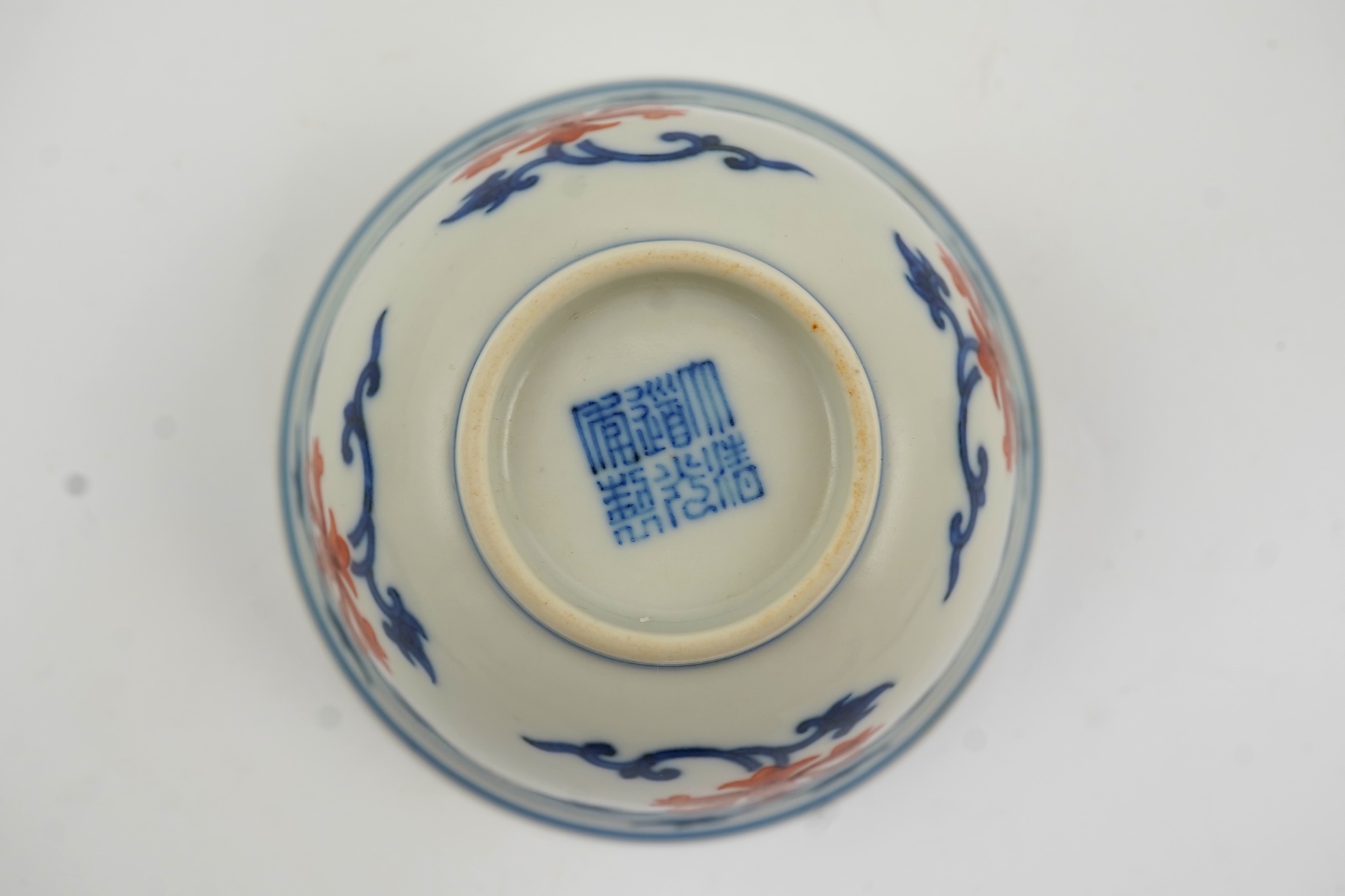 A Chinese underglaze blue and iron red bowl, Daoguang seal mark and possibly of the period